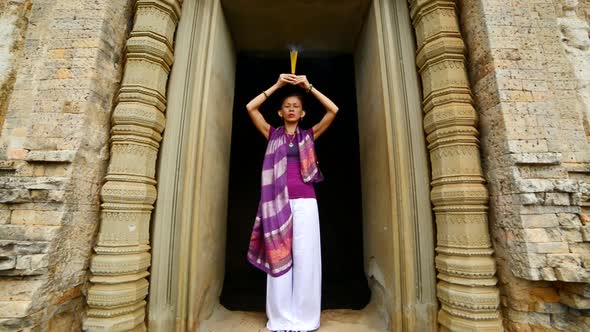 Female Buddhist Praying With Incense In Temple Doorway -   Angkor Wat Temple Cambodia 1