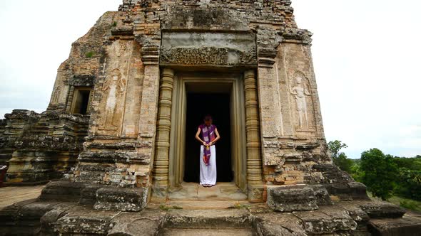 Female Buddhist Praying With Incense In Temple Doorway -   Angkor Wat Temple Cambodia 2 alt