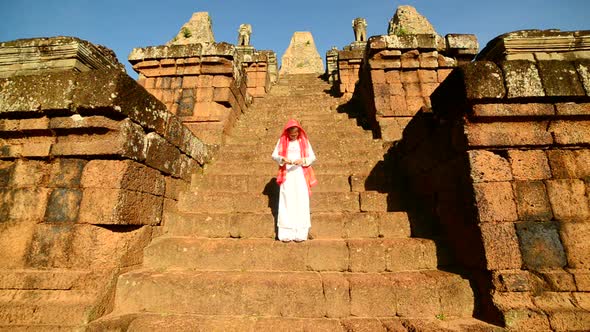 Female Buddhist Slowly Walking Down Temple Steps With Incense -  Angkor Wat Temple Cambodia 2 alt