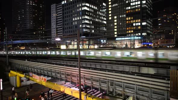 Train Passing Over Bridge In Central Tokyo Japan At Night 1 alt