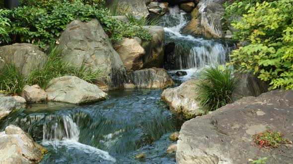 Waterfall Runs Into A Koi Pond At Sensoji Temple Tokyo Japan 2 alt