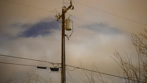 Time Lapse Of Telephone / Power Pole At Night alt