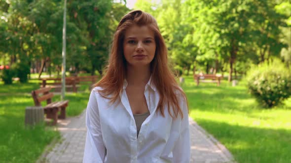 Caucasian Female in Casual White Shirt Outdoors