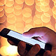 Man with a Touchscreen Phone on a Bokeh Background - VideoHive Item for Sale
