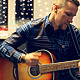 Man Playing an Acoustic Guitar on a Beautiful Back - VideoHive Item for Sale