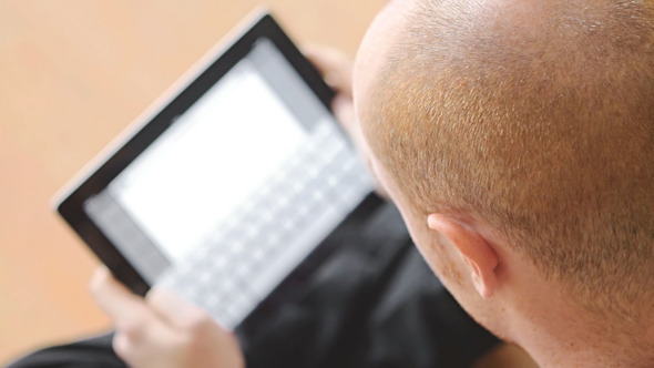 Young Student Working With Tablet PC alt