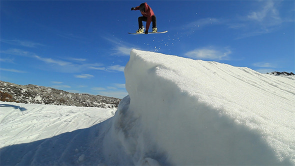 Skier and Snowboarder Jumping