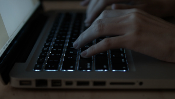 Woman Typing On Laptop