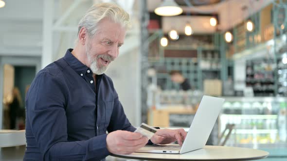 Successful Online Payment on Laptop By Old Man