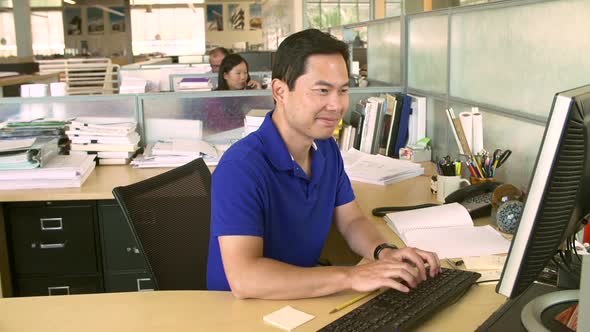 Man Working At Computer In Modern Office 3 alt