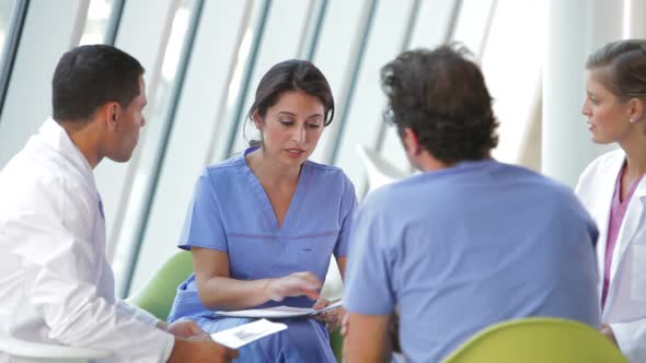 Medical Staff Meeting To Review Patient Notes