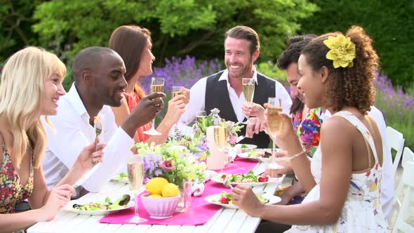 Friends Enjoying Outdoor Dinner Party 2