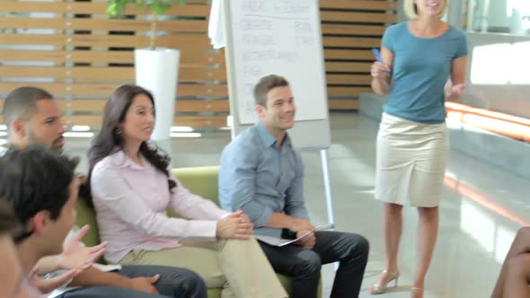 Businesswoman Leading Brainstorming Session With Colleagues 2 alt