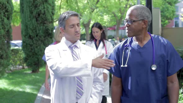 Medical Team Having Discussion Outdoors 2