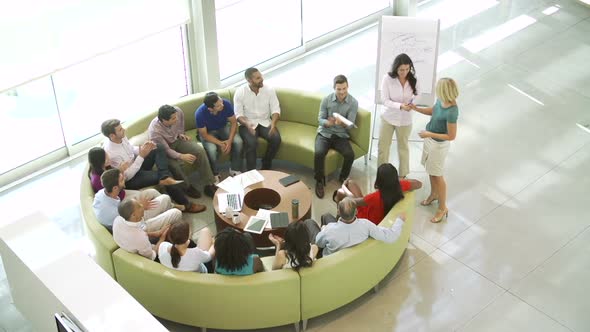 Businesswoman Leading Brainstorming Session With Colleagues 4