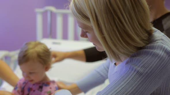 Family And Daughter With Staff In Pediatric Ward Of Hospital 2