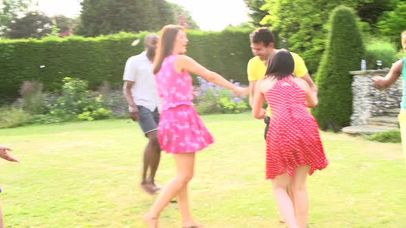 Friends Playing Football In Garden 2