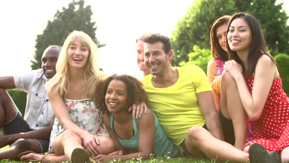 Friends Sitting On Grass Together 3