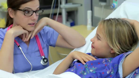 Young Girl Talking To Female Nurse In Intensive Care Unit 3