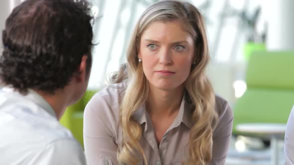 Businessman And Businesswomen Talking In Office