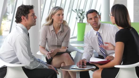 Group Of Business People Having Informal Meeting 1