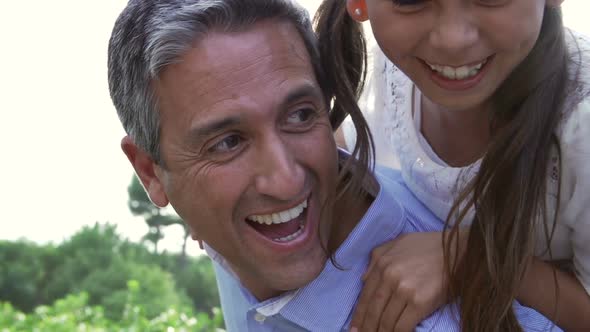 Parents Giving Children Piggybacks 2