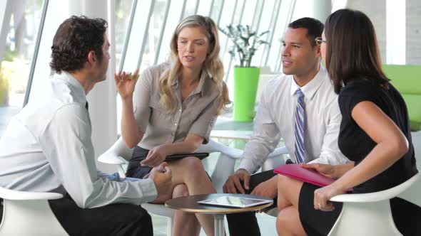 Group Of Business People Having Informal Meeting 2 alt