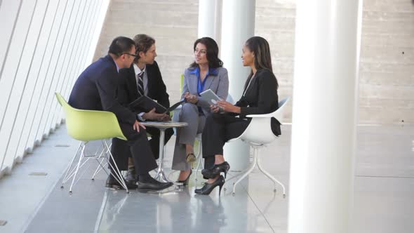 Group Of Business People Having Informal Meeting 5