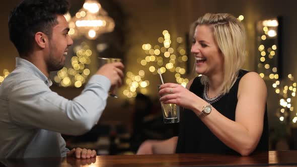 Couple On Date Enjoying Evening Drinks In Bar 2