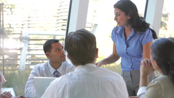 Group Of Businesspeople At Table Having Meeting