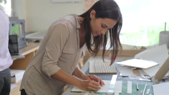 Two Architects Making Models In Office Together 2