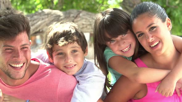 Family Having Fun In Park Together 1