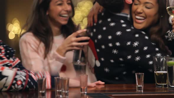 Drunk Woman In Bar During Christmas Drinks With Friends