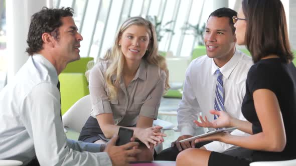 Businesspeople Using Digital Tablet In Meeting 2