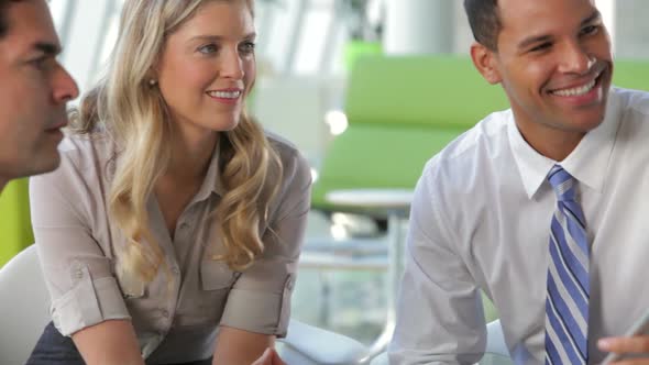 Businesspeople Using Digital Tablet In Meeting 3