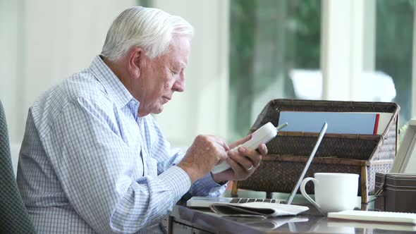 Senior Man Finding Phone Number Of Company Online 1