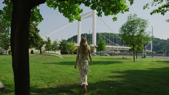 Woman walking towards Elisabeth Bridge