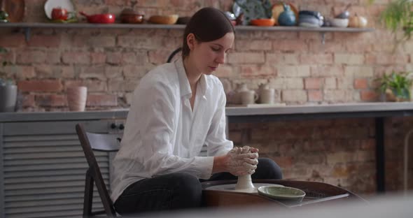 Ceramist Sculpts on a Potter's Wheel Video From Pottery Workshop Potter Makes Ceramics in Slow
