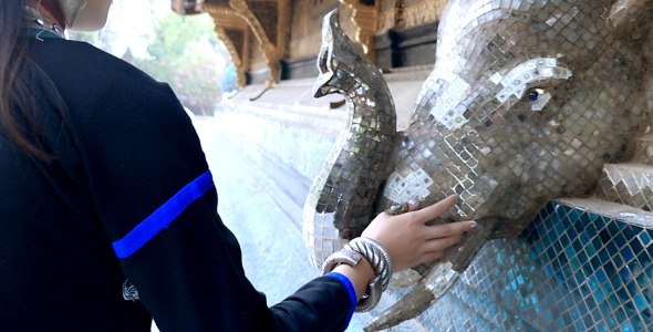 Hand Touching The Temple Wall