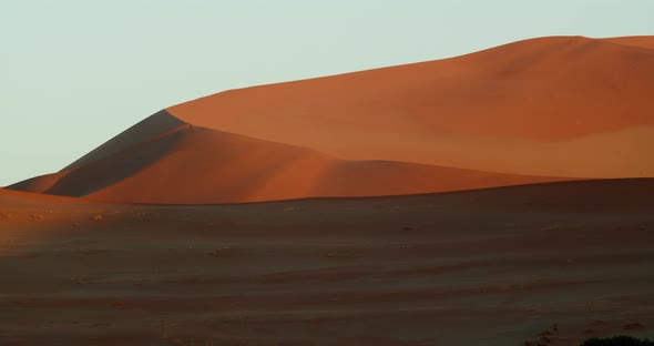 Huge orange sand dune in the Namib desert, stunning colorful footage, 4k