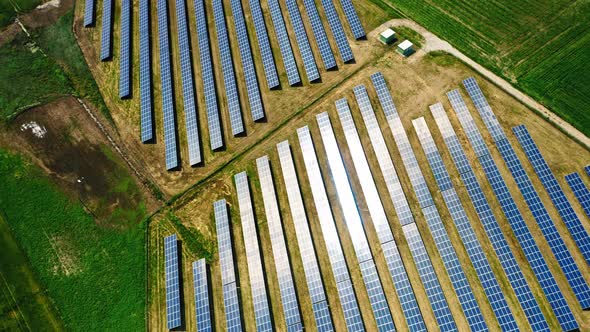 Top view of solar panels on field, aerial view