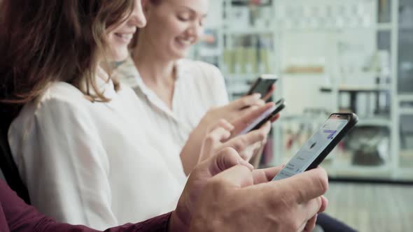 Young Business Team Using Smartphone On Modern Office