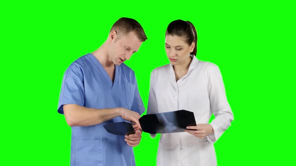 Two Doctors with X-ray Prints. Green Screen