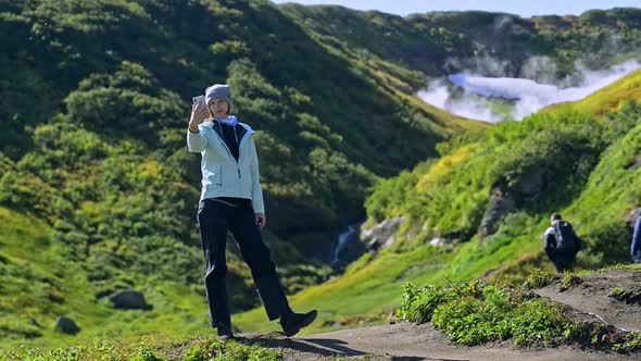 Hiking and Eco Tourism Woman Makes Selfie Posing on Path Avki