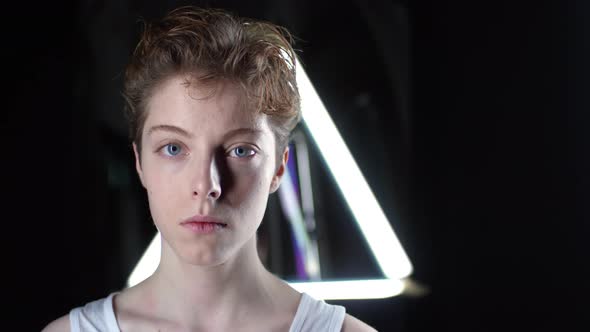 Young Woman on Dark Background