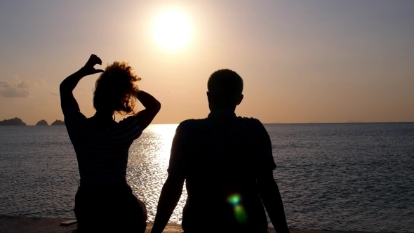 Silhouette Of Couple In Love At Sunset