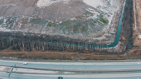 Aerial Shot Landfill with Working Trucks