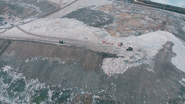 Aerial Shot Landfill with Working Trucks