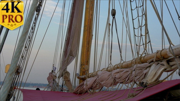 Ropes and Rolled Big Clothes on the Sail Mas