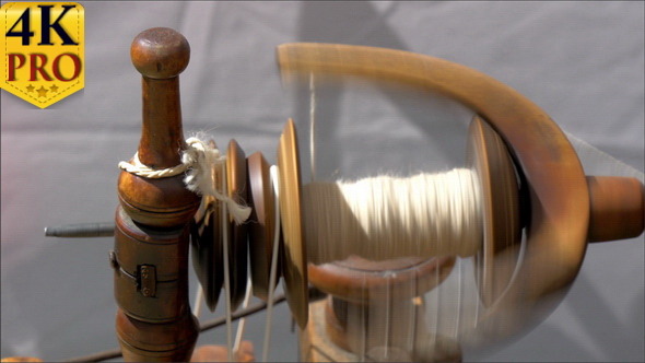 An Old Spinning Wheel Fastly Turning